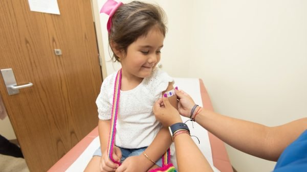 Health worker vaccinating a child; representative image, CDC/Unsplash